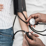 Doctor providing chronic disease management for diabetes and hypertension in hospital