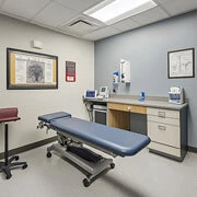 Doctor consulting patient in private hospital room during room allocation process in Nashik hospital