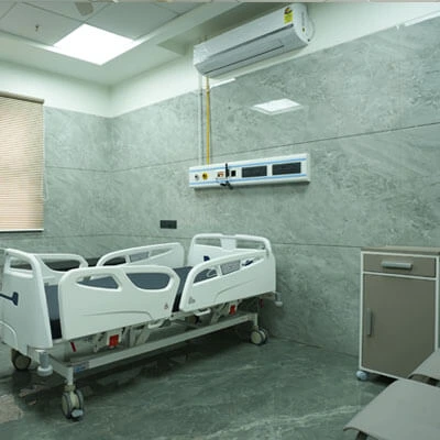 Deluxe hospital room with modern amenities and attached bathroom in Nashik