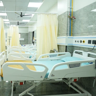 Spacious general ward room with multiple beds at multispeciality hospital in Nashik